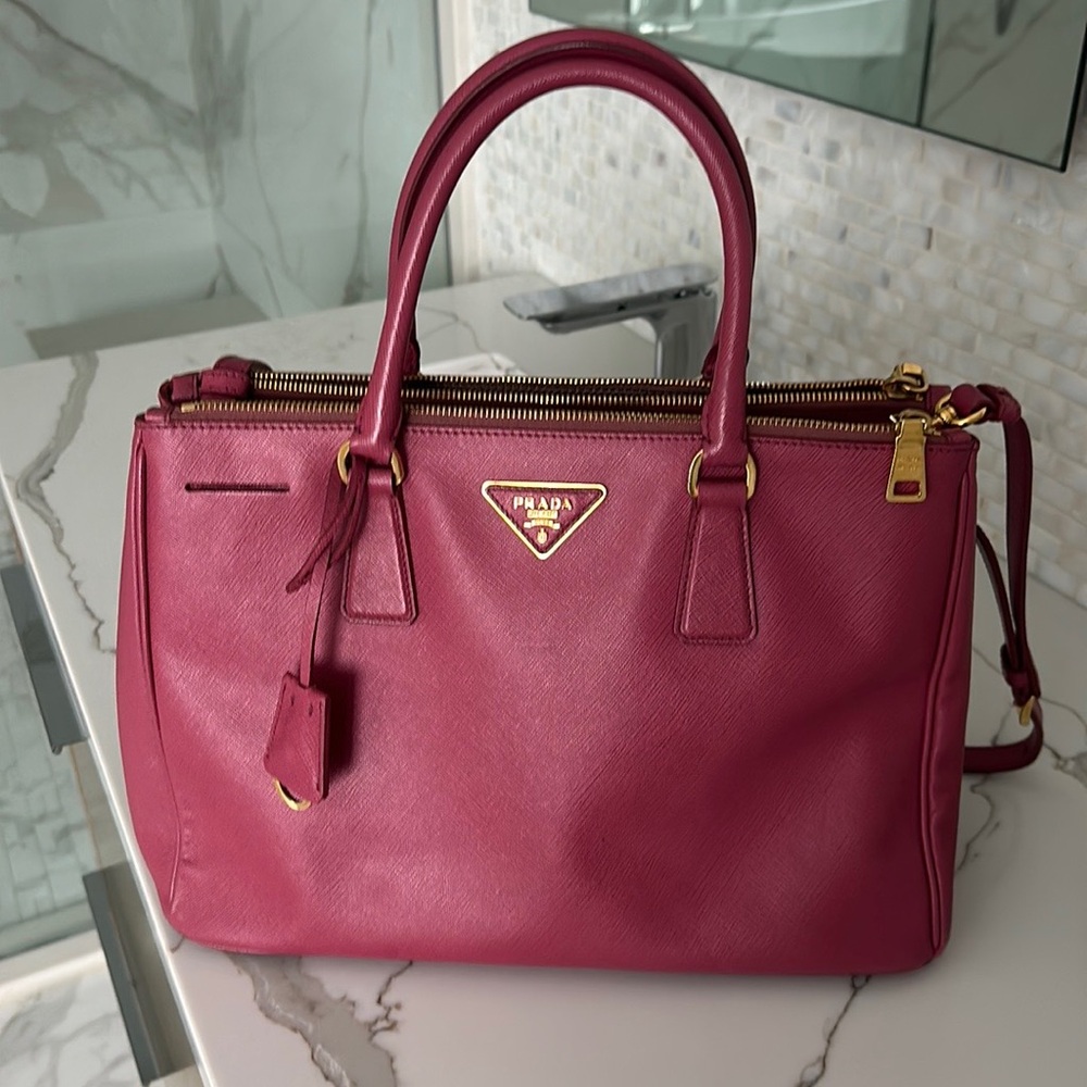 Prada galleria double zip tote in dark mauve.